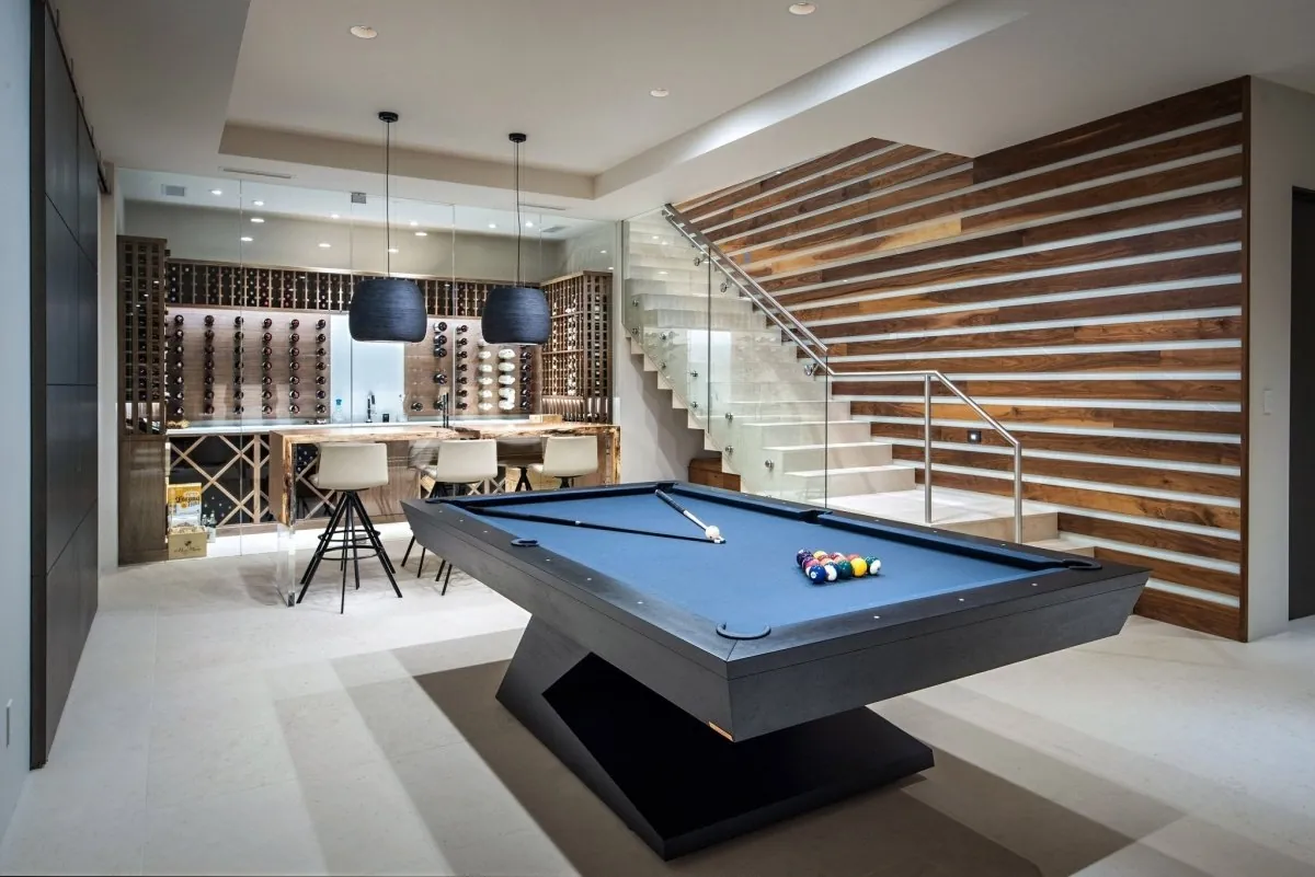 Slate pool table beside a much lighter non-slate table